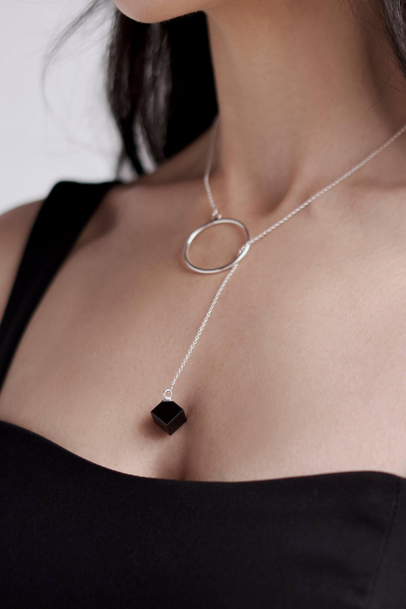 Lariat necklace with obsidian cube