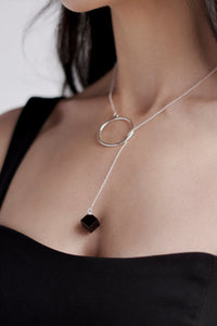 Lariat necklace with obsidian cube