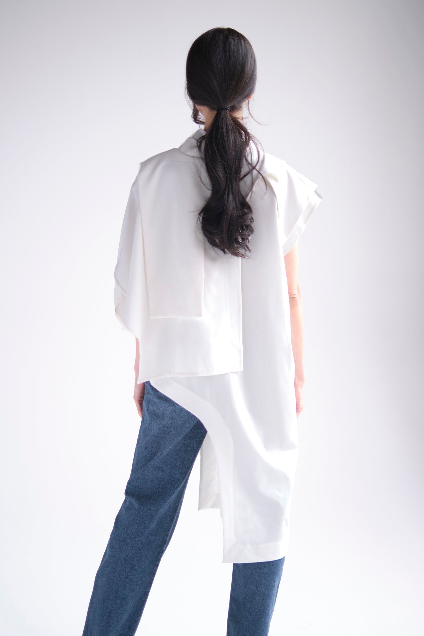 Asymmetrical layered tunic with high neck in white