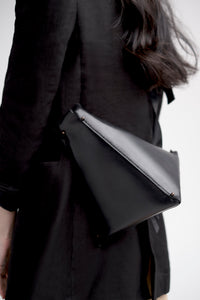 Pyramid crossbody bucket bag in black