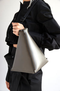 Pyramid crossbody bucket bag in gray