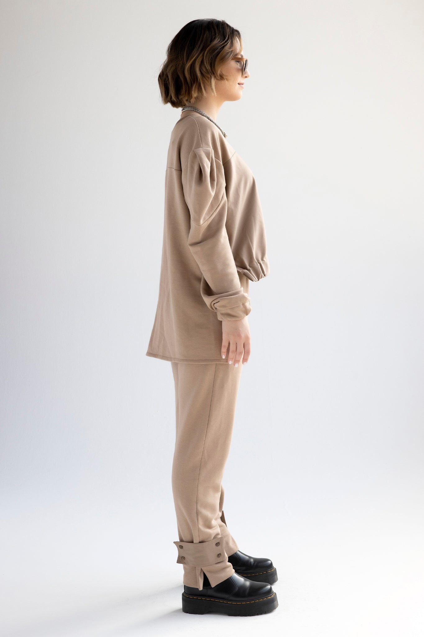 Relaxed cotton track pants with detachable tab cuffs in tan